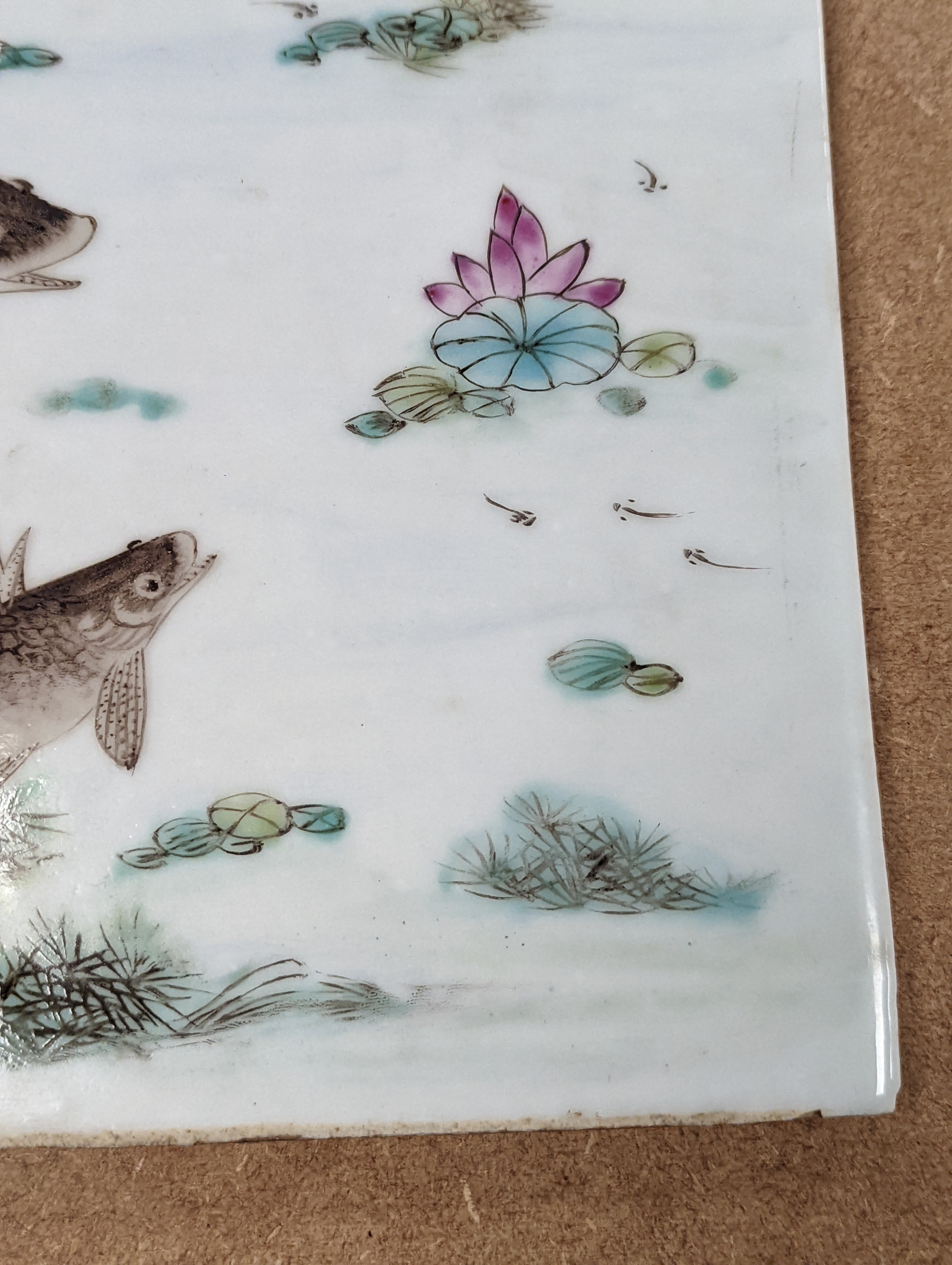 A Chinese famille rose porcelain rectangular plaque, Republic period (1912-49), painted with fish in a pond amid weed and inscribed upper left 36.5x25.5cm